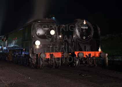 Purchase photo of 34007 WADEBRIDGE &  92212 9F at Mid Hants Railway